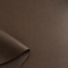 Close-up of the surface of soft faux leather in brown
