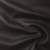 Soft faux leather in dark brown laid in soft folds