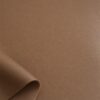 Close-up of the surface of soft faux leather in nougat