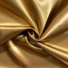 Kraftig satin i guld 100% polyester 120 g/m²