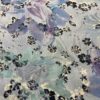 Close-up of floral print on viscose satin on a light background