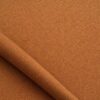 Close-up of the surface of textured upholstery fabric in cognac