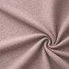 Textured upholstery fabric in dusky old pink laid in soft folds