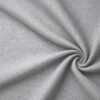 Textured upholstery fabric in grey laid in soft folds