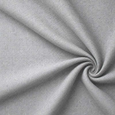 Textured upholstery fabric in grey laid in soft folds