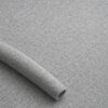Close-up of the surface of textured upholstery fabric in grey