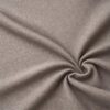 Textured upholstery fabric in light taupe laid in soft folds