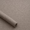 Close-up of the surface of textured upholstery fabric in light taupe