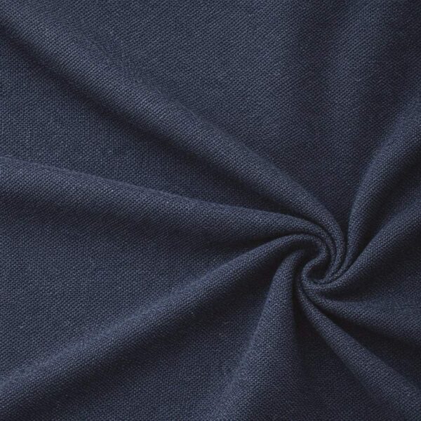 Textured upholstery fabric in navy blue laid in soft folds