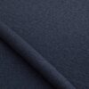 Close-up of the surface of textured upholstery fabric in navy blue