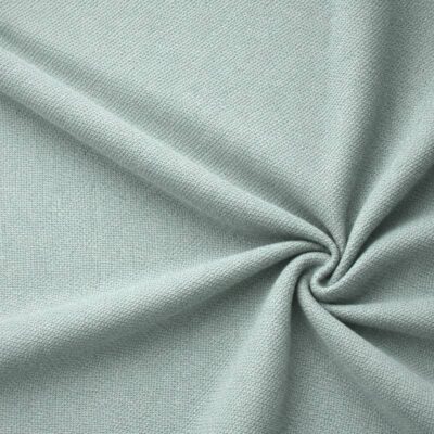 Textured upholstery fabric in mint laid in soft folds