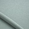 Close-up of the surface of textured upholstery fabric in mint