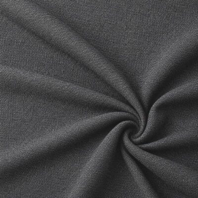 Textured upholstery fabric in dark grey laid in soft folds
