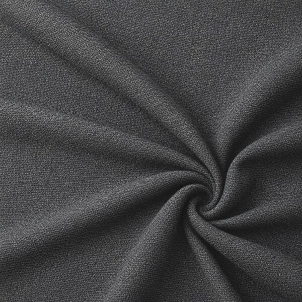 Textured upholstery fabric in dark grey laid in soft folds