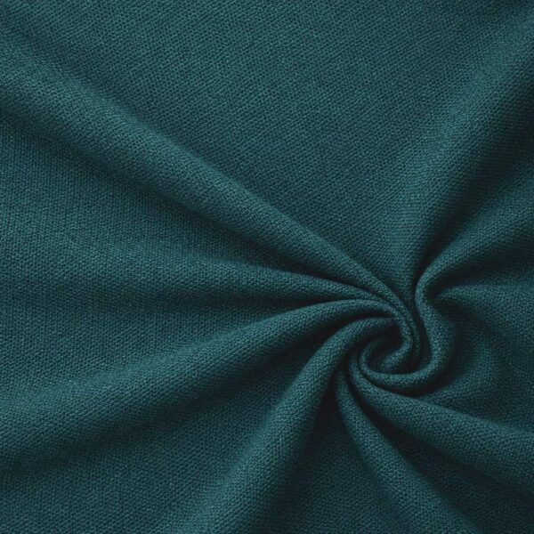Textured upholstery fabric in petrol laid in soft folds