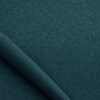 Close-up of the surface of textured upholstery fabric in petrol