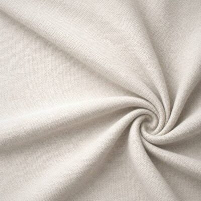 Textured upholstery fabric in off-white laid in soft folds