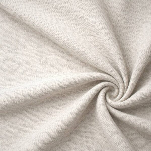 Textured upholstery fabric in off-white laid in soft folds