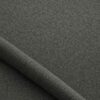 Close-up of the surface of textured upholstery fabric in forest green