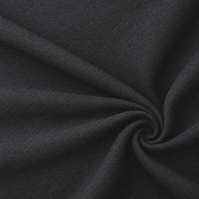 Textured upholstery fabric in black laid in soft folds