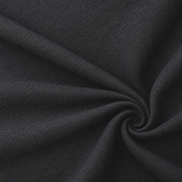 Textured upholstery fabric in black laid in soft folds