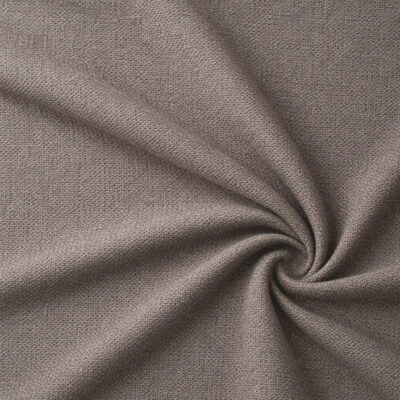 Textured upholstery fabric in taupe laid in soft folds