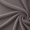Corduroy upholstery velour in ash grey laid in soft folds