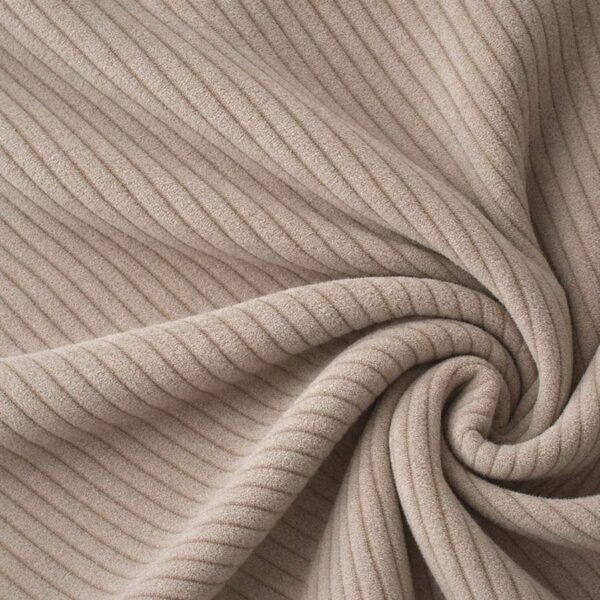 Corduroy upholstery velour in beige laid in soft folds