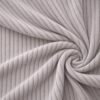 Corduroy upholstery velour in dusky grey laid in soft folds