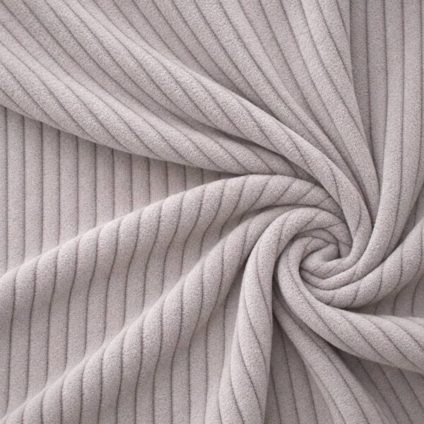Corduroy upholstery velour in dusky grey laid in soft folds