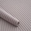 Close-up of the surface of corduroy upholstery velour in dusky grey