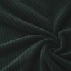 Corduroy upholstery velour in bottle green laid in soft folds