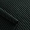 Close-up of the surface of corduroy upholstery velour in bottle green