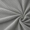 Corduroy upholstery velour in grey laid in soft folds