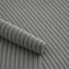 Close-up of the surface of corduroy upholstery velour in grey