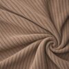 Corduroy upholstery velour in caramel laid in soft folds