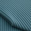 Close-up of the surface of corduroy upholstery velour in light petrol