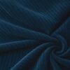 Corduroy upholstery velour in navy blue laid in soft folds
