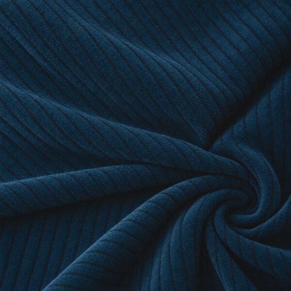 Corduroy upholstery velour in navy blue laid in soft folds