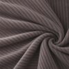 Corduroy upholstery velour in mocha laid in soft folds