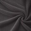 Corduroy upholstery velour in dark grey laid in soft folds