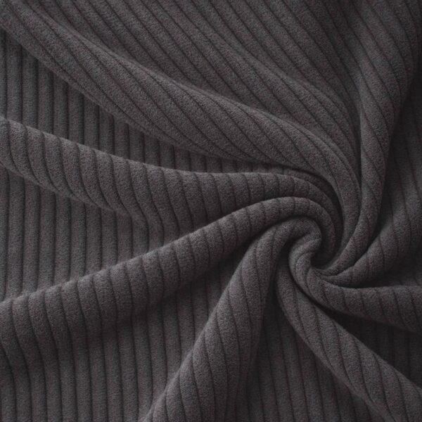 Corduroy upholstery velour in dark grey laid in soft folds