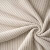 Corduroy upholstery velour in pearl white laid in soft folds