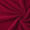 Corduroy upholstery velour in red laid in soft folds