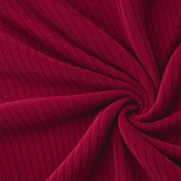 Corduroy upholstery velour in red laid in soft folds