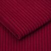 Close-up of the surface of corduroy upholstery velour in red