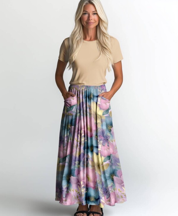 Digital print jersey fabric with pastel tones and gold flowers on a light base