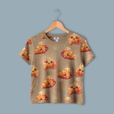 Digitalprint jersey stof med croissant print på sandfarvet bund