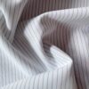 Poplin with narrow blue stripes in 50% polyester and 50% cotton, 120 g/m²