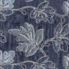 Nærbillede af blad broderi på blå vævet denim